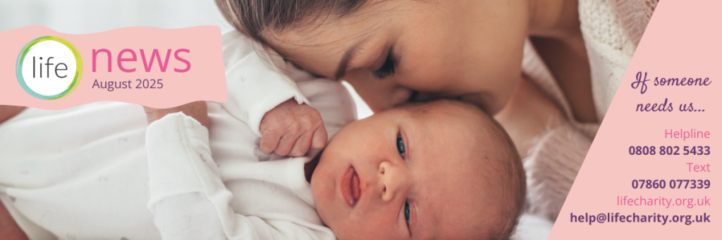 mum kissing baby